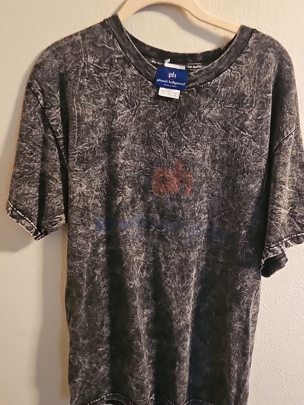 vintage Planet Hollywood graphic t-shirt featuring a distressed black